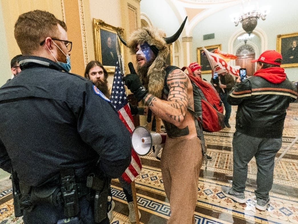 Jacob Anthony Chansley, who also goes by the name Jake Angeli, is among those charged in the deadly Jan. 6 insurrection that a second impeachment charge accuses President Donald Trump of inciting.