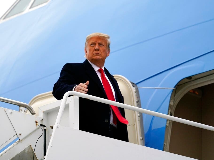 President Donald Trump gestures as he boards Air Force One upon arrival at Valley International Airport, in Harlingen, Texas.