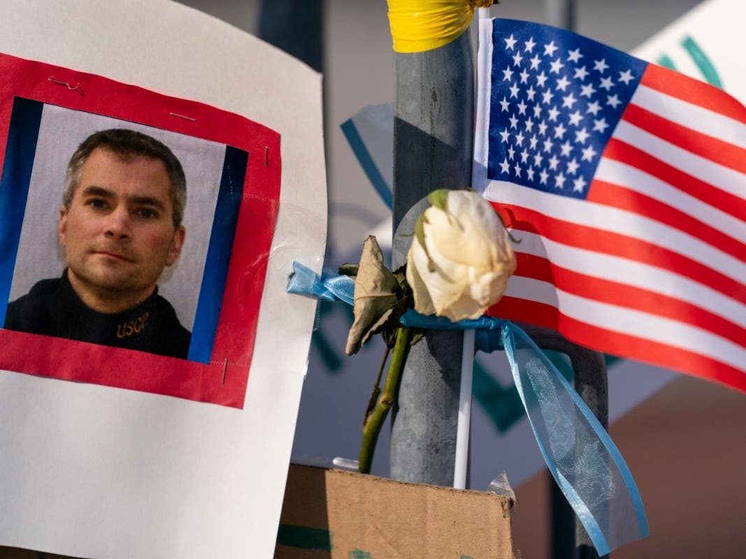 A memorial for U.S. Capitol Police officer Brian D. Sicknick is visible near the U.S. Capitol building on Capitol Hill in Washington, Thursday, Jan. 14, 2021. Officer Sicknick was killed by rioters in last Wednesday's attack on the Capitol Building.