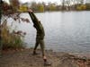 Writer, musician actor and singer Lori Brigantino stretches during a stop while riding her bicycle through the peninsula on the lake in Prospect Park, Sunday, Nov. 15, 2020, in the Brooklyn borough of New York.