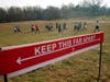 Curly Shirley Catton's exercise class walks through the Nethermead, a meadow, Thursday, Jan. 14, 2021, in Brooklyn's Prospect Park in New York.