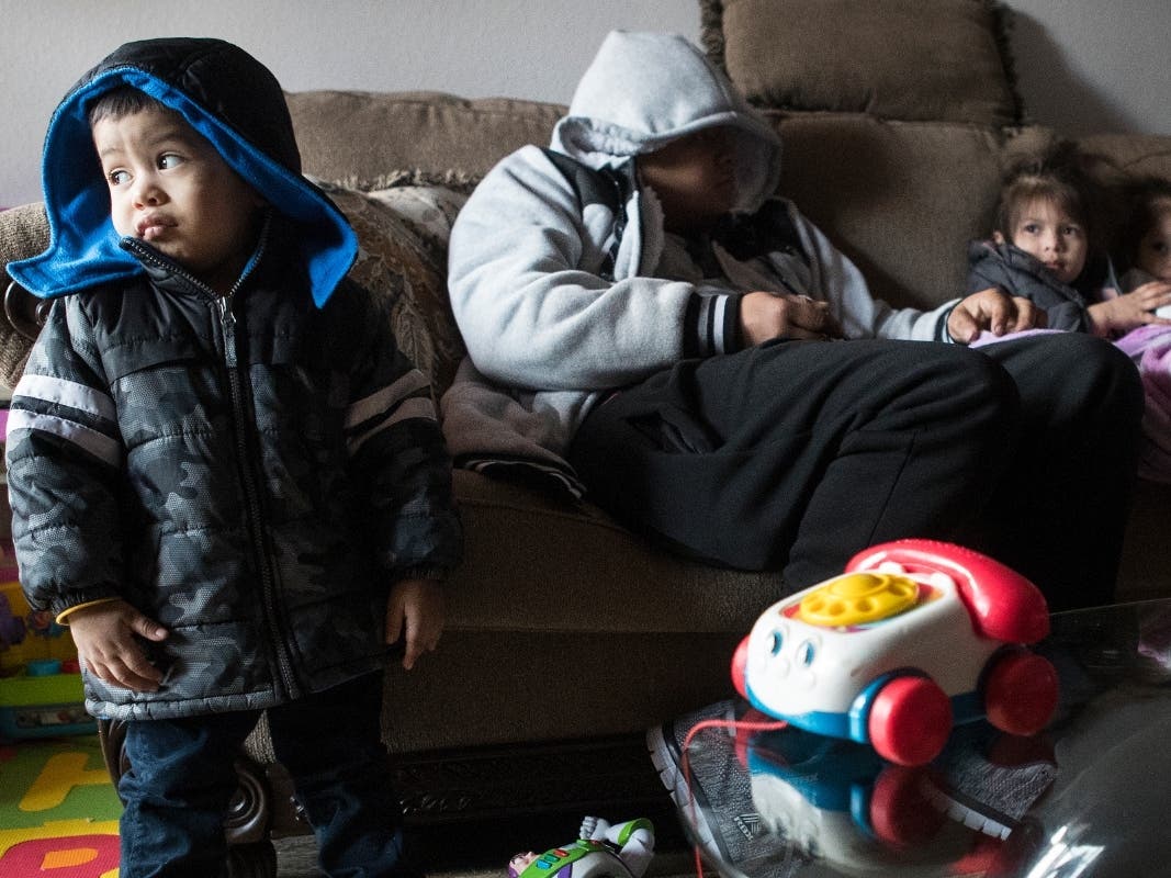 In this Feb. 15 file photo, Eithan Colindres wears a winter coat inside after the apartment his family lives in lost power following an overnight snowfall in Houston. 