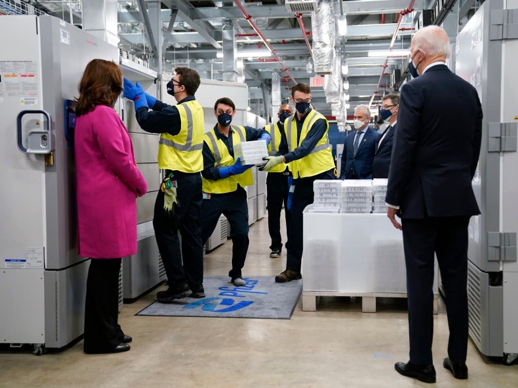 President Joe Biden, right, and Michigan Gov. Gretchen Whitmer, left, tour a Pfizer manufacturing site in Portage, Michigan. 