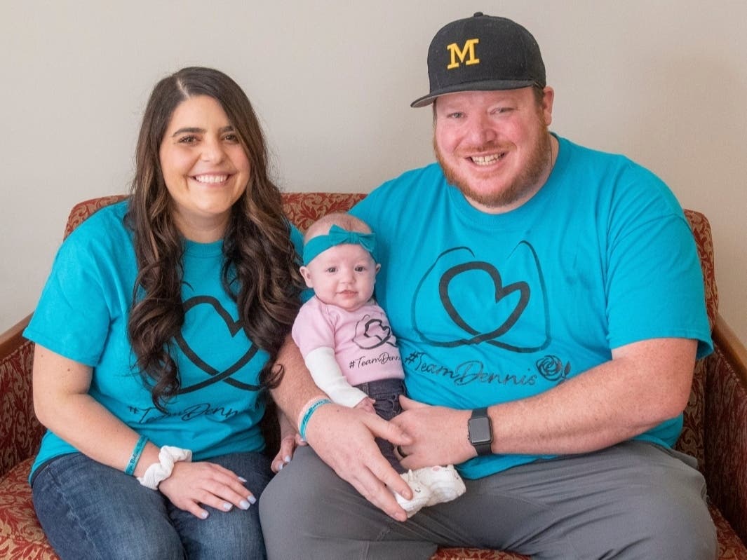 ​Jackie Dennis, pictured here with her husband, Ricky, and their daughter, Mia Rose, is recovering at Henry Ford Health System in Detroit after a double lung transplant. She gave birth in November after having been diagnosed with COVID-19.
