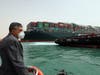 Lt. Gen. Ossama Rabei, head of the Suez Canal Authority, investigates the situation with the Ever Given, a Panama-flagged cargo ship, after it become wedged across the Suez Canal and blocking traffic in the vital waterway.