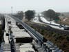 In this Oct. 9, 2019, file photo, is the high-speed rail viaduct paralleling Highway 99 near Fresno, Calif. 
