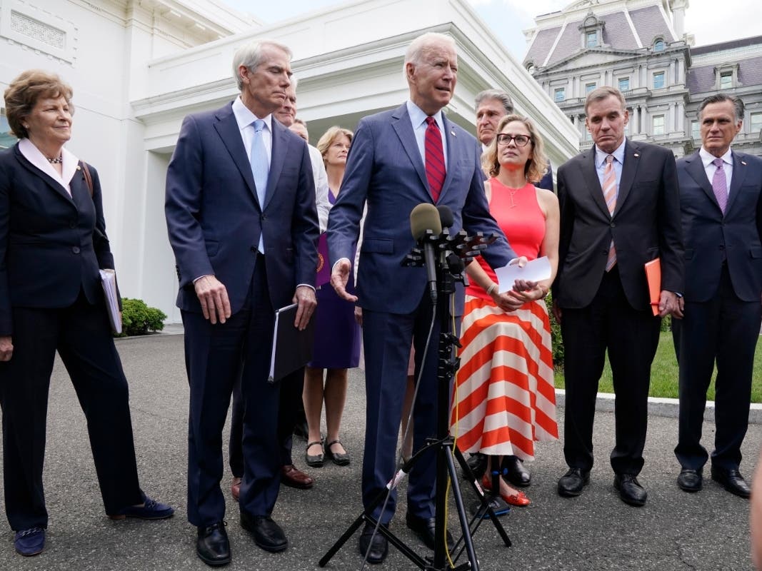 President Joe Biden, with a bipartisan group of senators, speaks Thursday June 24, 2021, outside the White House in Washington.