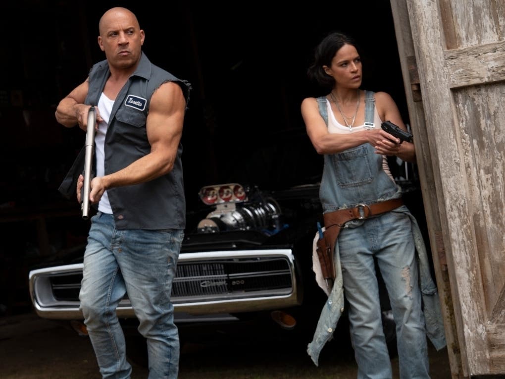 This image released by Universal Pictures shows Vin Diesel, left, and Michelle Rodriguez in a scene from "F9: The Fast Saga." 