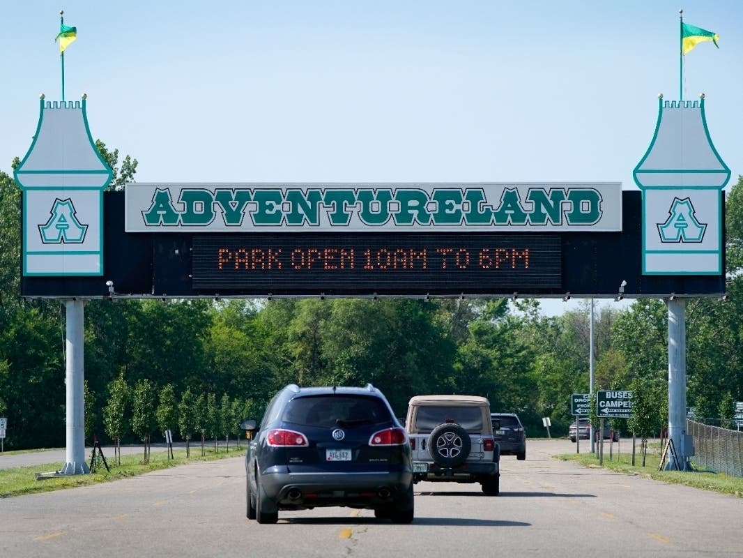The father of an 11-year-old boy who died following an accident on the popular boat ride at Adentureland Park in Altoona, Iowa, said his son and other family members were trapped by the ride's seat belts when the boat carrying them flipped. 