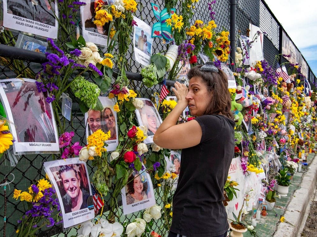 Gini Gonte visits the Surfside Wall of Hope & Memorial on Wednesday as she honors her friends Nancy Kress Levin and Jay Kleiman, who lost their lives after the collapse of the Champlain Towers South in Surfside.