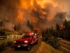Firefighters battle the Tamarack Fire in the Markleeville community of Alpine County, Calif., on Saturday, July 17, 2021.