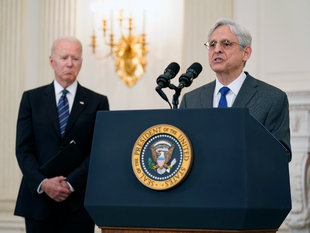 In this June 23, 2021 file photo, President Joe Biden listens as Attorney General Merrick Garland speaks during an event in the State Dining room of the White House in Washington to discuss gun crime prevention strategy.