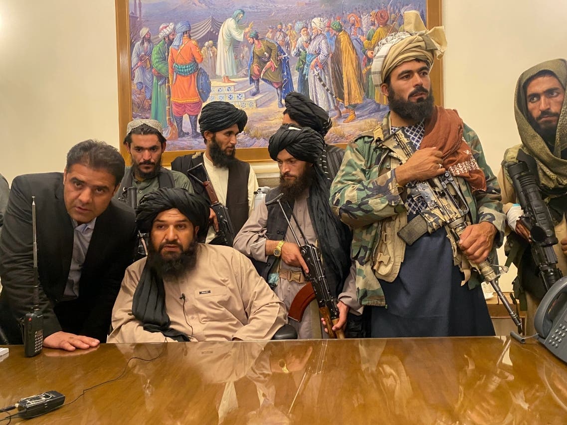 Taliban fighters take control of Afghan presidential palace after the Afghan President Ashraf Ghani fled the country, in Kabul, Afghanistan.