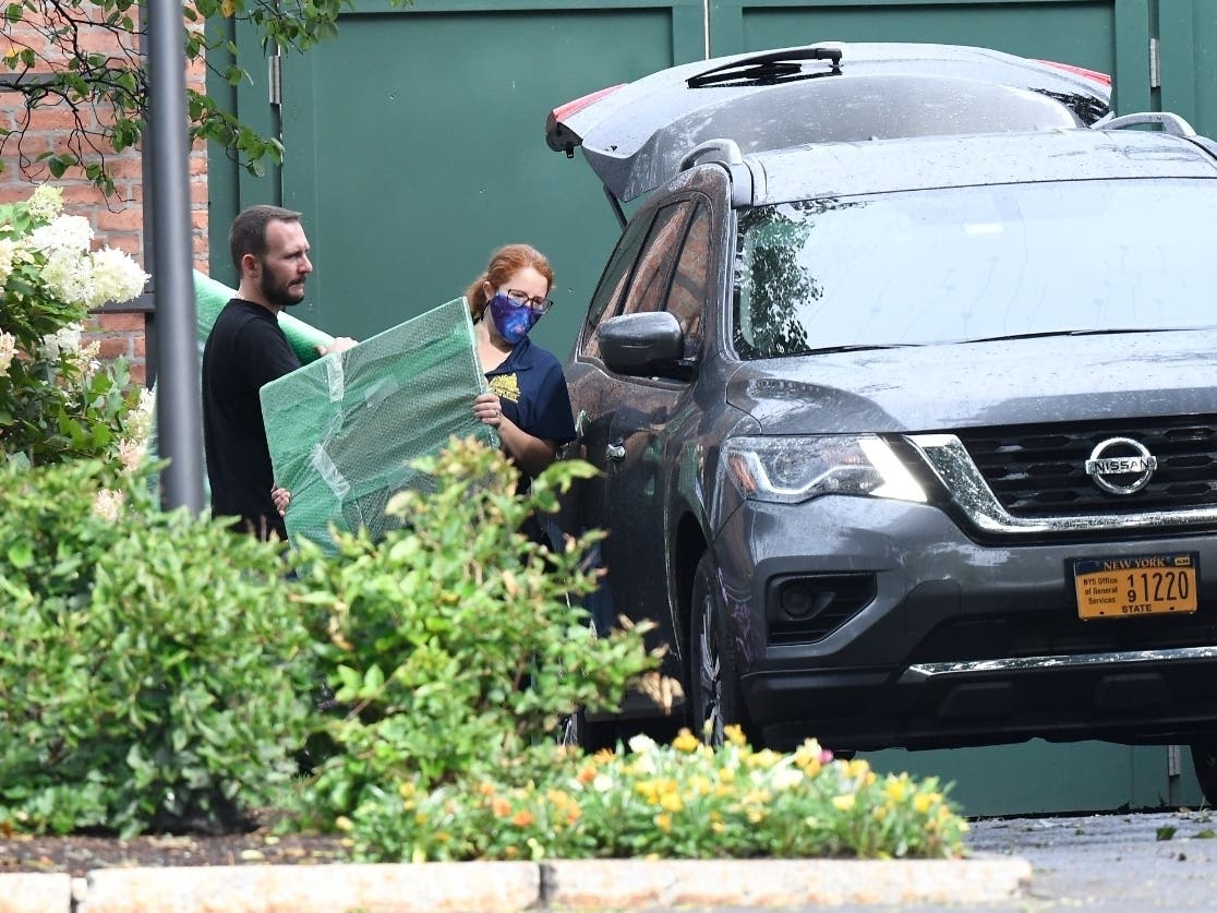 Crews from the Office of General Services load belongings of New York Gov. Andrew Cuomo into vehicles at the New York state Executive Mansion, Friday Aug. 20, 2021.
