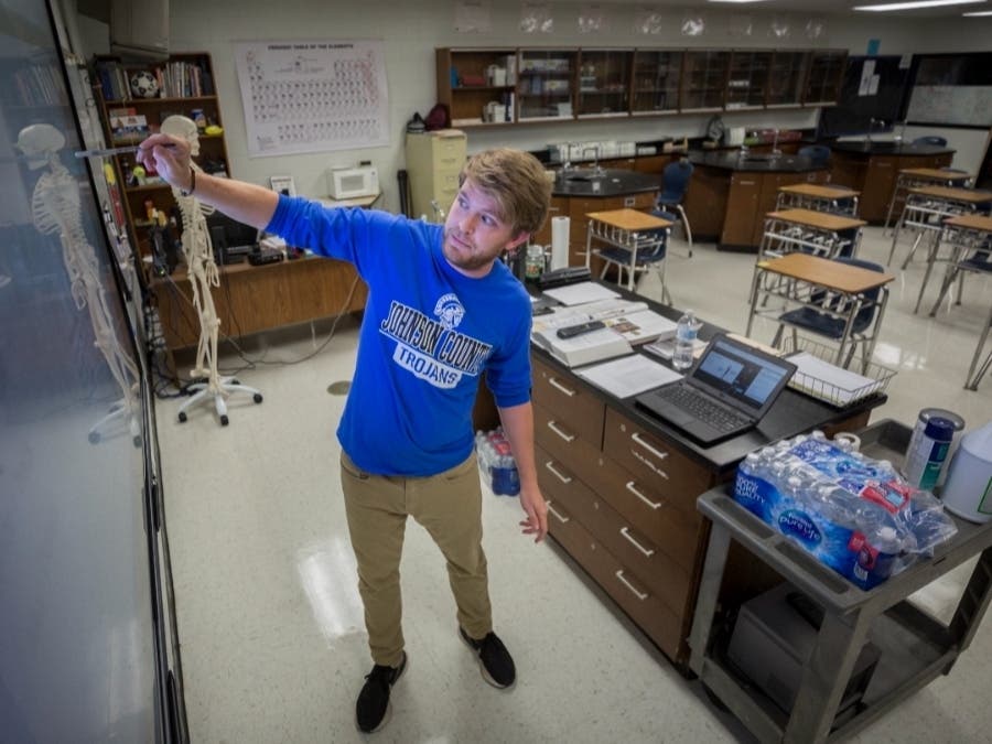 Johnson County High School teacher Michael Caneege teaches anatomy to his students online in Wrightsville, Georgia. A few weeks into the new school year, growing numbers of U.S. districts have halted in-person learning or switched to hybrid models.