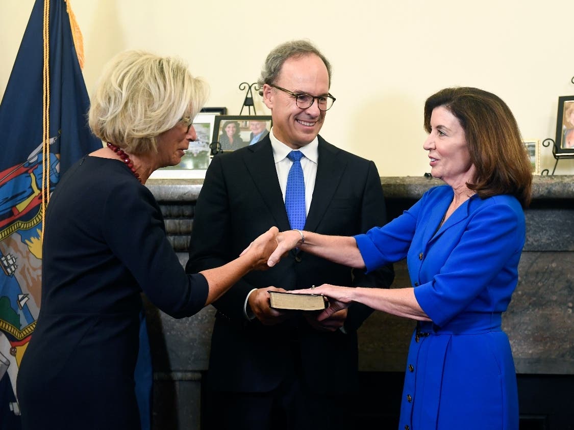 New York Chief Judge Janet DiFiore swears in Kathy Hochul as the first woman to be New York's governor during a swearing-in ceremony in the Red Room at the state Capitol, early Tuesday, Aug. 24, 2021, in Albany, N.Y.