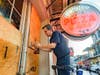 Michael Richard of Creole Cuisine Restaurant Concepts boards up Crescent City Pizza on Bourbon Street in the French Quarter before landfall of Hurricane Ida in New Orleans