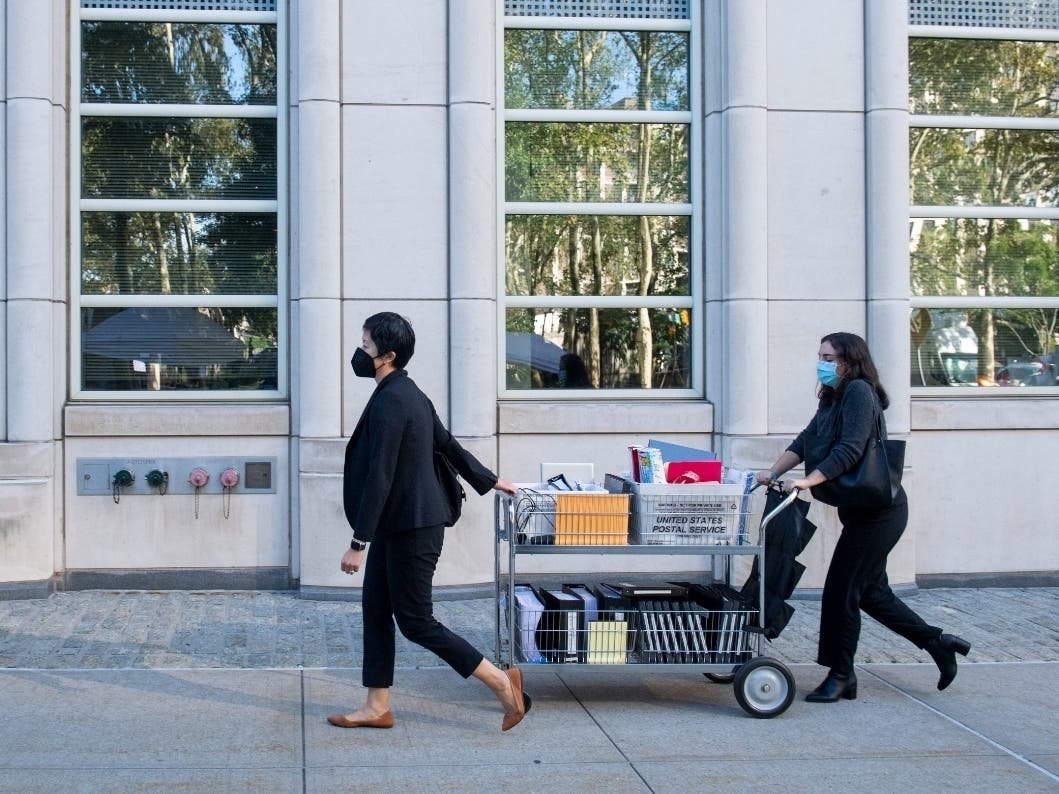 Paralegals arrive at the Brooklyn Federal Court House on Monday, Sept. 27, 2021.