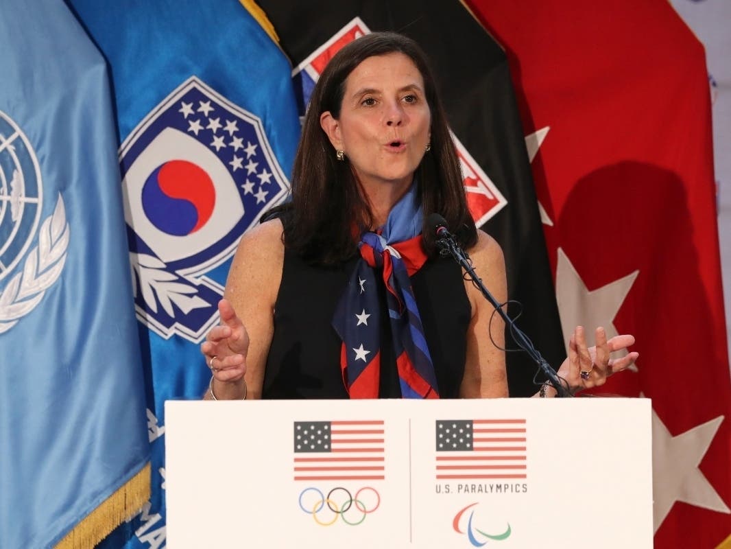 In this Aug. 1, 2017, photo, then-U.S. Olympic Committee chief marketing officer Lisa Baird speaks about the Team USA WinterFest for the upcoming 2018 Pyeongchang Winter Olympic Games, at Yongsan Garrison, a U.S. military base in South Korea.