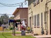 A woman hangs laundry outside a pubic housing building in September in Phoenix. Soaring temperatures are making it harder to live in the United States' already hot, fast growing desert areas.