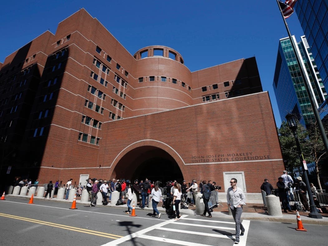 In this Sept. 13, 2019 file photo, media wait outside the federal courthouse in Boston — that for actress Felicity Huffman to arrive for sentencing after pleading guilty.
