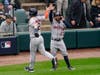 Houston Astros' Alex Bregman (left) and Jose Altuve celebrate scoring on a Carlos Correa double against the Chicago White Sox in the third inning during Game 4 of the American League Division Series on Tuesday in Chicago.