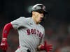 Boston Red Sox's Enrique Hernandez celebrates after a home run against the Houston Astros during the third inning in Game 1 of baseball's American League Championship Series Friday in Houston.