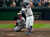 Houston Astros' Carlos Correa hits single against the Boston Red Sox during the third inning in Game 1 of baseball's American League Championship Series Friday in Houston.