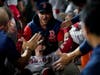 Boston Red Sox's Enrique Hernandez celebrates in the dugout after a home run against the Houston Astros during the third inning in Game 1 of baseball's American League Championship Series Friday in Houston. 