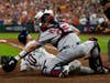 Houston Astros' Yuli Gurriel scores past Boston Red Sox catcher Kevin Plawecki on a sacrifice flay by Jose Altuve during the eighth inning in Game 1 of baseball's American League Championship Series Friday in Houston.