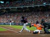 Boston Red Sox's Rafael Devers hits a grand slam home run against the Houston Astros during the second inning in Game 2 of baseball's American League Championship Series Saturday in Houston.