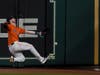 Houston Astros right fielder Kyle Tucker can't get a glove on a double by Boston Red Sox's Xander Bogaerts during the ninth inning in Game 2 of baseball's American League Championship Series Saturday in Houston.