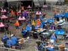 In this May 6 file photo, Maricopa County ballots cast in the 2020 general election are examined and recounted by contractors working for Cyber Ninjas at Veterans Memorial Coliseum in Phoenix.