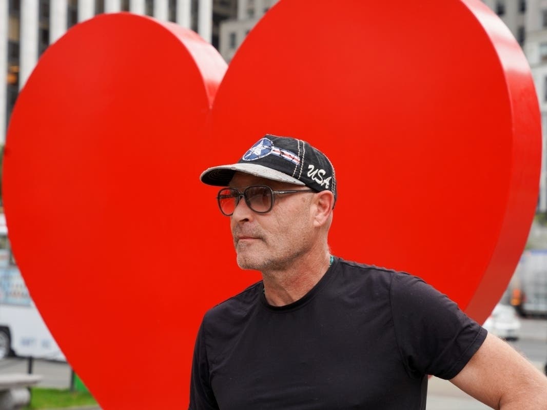  Italian sculptor Sergio Furnari poses for pictures in front of "The Hero Monument" heart sculpture that he made, a symbol of hope and love dedicated to health care workers around the world.