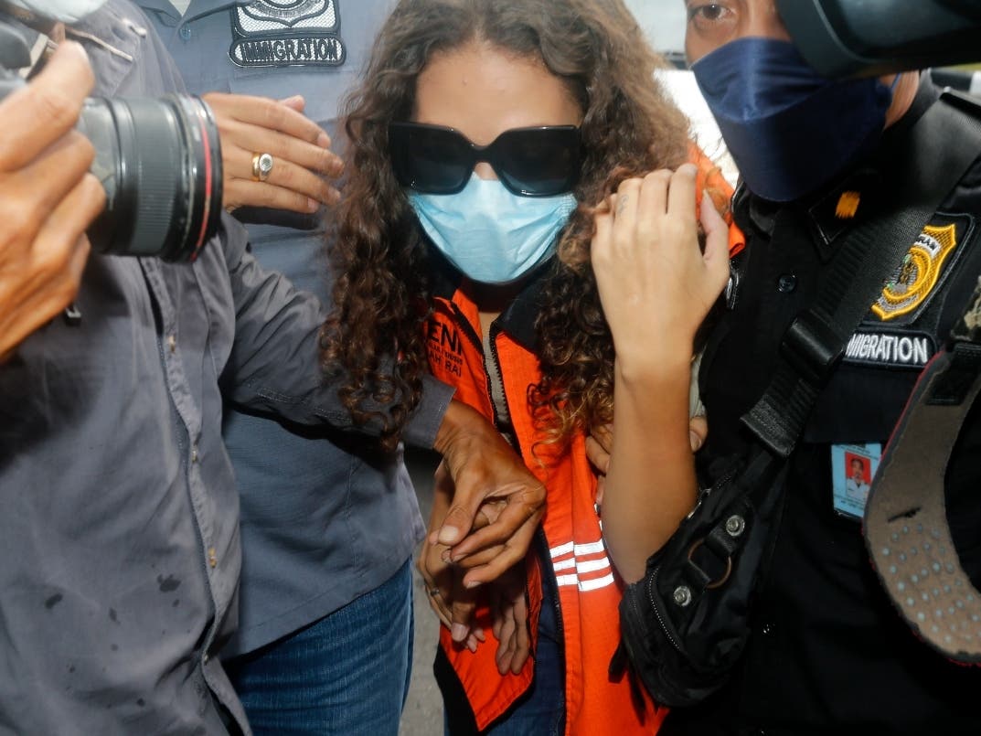 Heather Mack is escorted by immigration officers to Immigration detention center in Jimbaran, Bali, Indonesia on Friday.