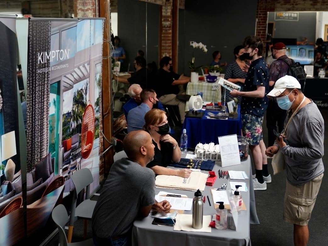 Prospective employers and job seekers interact during a job fair in the West Hollywood section of Los Angeles in September. California is now tied with Nevada for the highest unemployment rate in the country at 7.5 percent, according to new data.