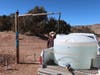 Phillip Yazzie waits for a water drum in the back of his pickup truck to be filled in Teesto, Arizona, on the Navajo Nation in February. 