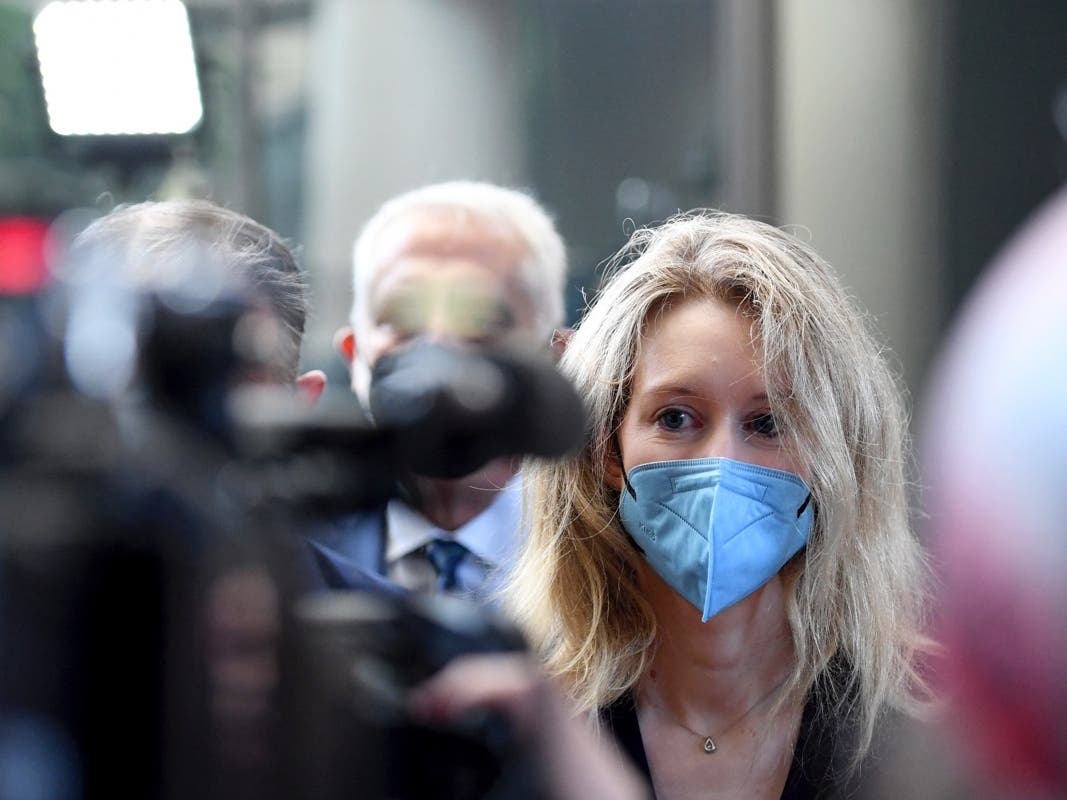 In this Tuesday, Aug. 31, 2021, file photo, Elizabeth Holmes, founder and CEO of Theranos, arrives at the federal courthouse for jury selection in her trial, in San Jose, Calif. 