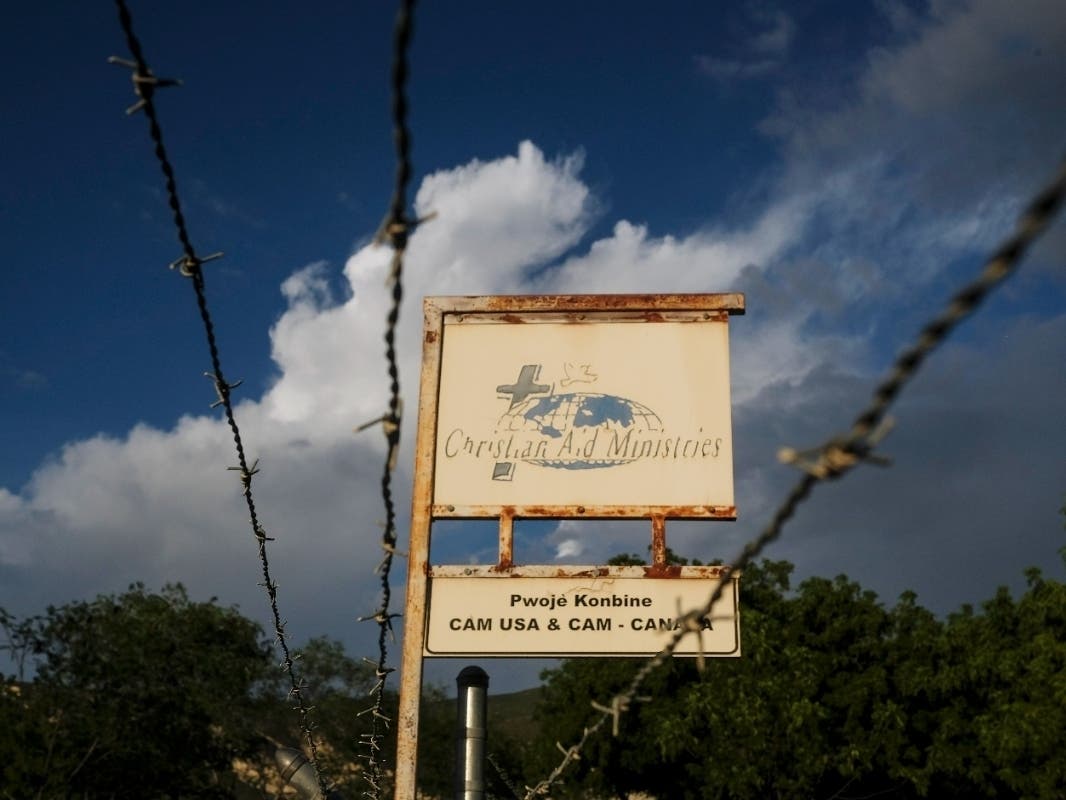 This Oct. 21, 2021, photo shows a sign outside Christian Aid Ministries in Titanyen, Haiti, which had 17 of their members kidnapped by the 400 Mawozo gang.