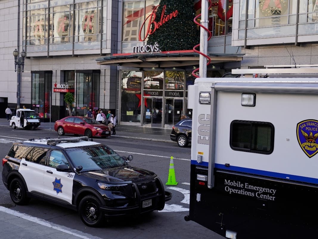 Police vehicles are stationed at Union Square following recent robberies in San Francisco on Dec. 2, 2021. 