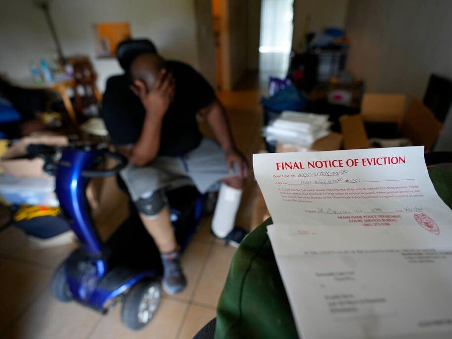 Freddie Davis, whose landlord raised his rent by 60 percent in the same month Davis lost his job as a truck driver, waits for a friend to arrive to help him move his remaining belongings to a storage unit, after receiving a final eviction notice.