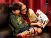 Nicole Olson and her son Porter, 10, look at his baby pictures at their home, Dec. 17 in Phoenix. Porter was relinquished at birth through what's known as a safe haven law.