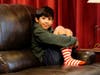 Porter Olson, 10, sits at home on Dec. 17 in Phoenix.