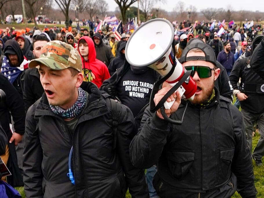 Proud Boys members Zachary Rehl, left, and Ethan Nordean, left, walk toward the U.S. Capitol in Washington, in support of President Donald Trump on Jan. 6.