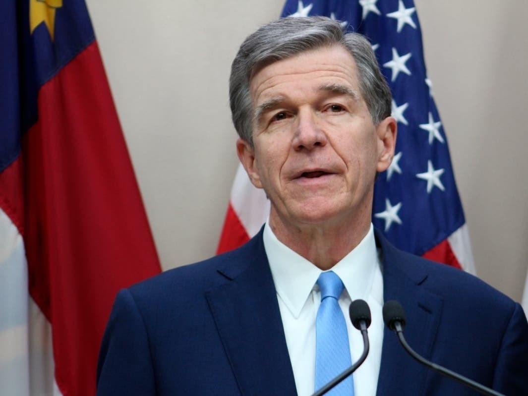 North Carolina Democratic Gov. Roy Cooper holds a news conference in the state Administration Building on Tuesday, Nov. 16, 2021, in Raleigh, N.C. North Carolina, the nation's ninth-largest state, was the last to enact a budget for 2021.