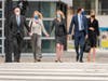 Elizabeth Holmes, center, walks to federal court in San Jose, Calif., Monday, Jan. 3, 2022. 