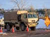 Members of the Colorado National Guard work a road block Monday in the area where the Marshall wildfire may have started, officials said.