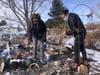 Karen England Horan with her son Robert, right, as they sift through the remains of her condo looking for jewelry and family heirlooms after it was destroyed by a wildfire that swept through her neighborhood in Louisville.