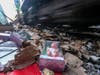 Shredded boxes and packages are seen at a section of the Union Pacific train tracks in downtown Los Angeles Friday, Jan. 14, 2022.