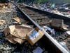 Shredded boxes and packages are seen at a section of the Union Pacific train tracks in downtown Los Angeles Friday, Jan. 14, 2022.